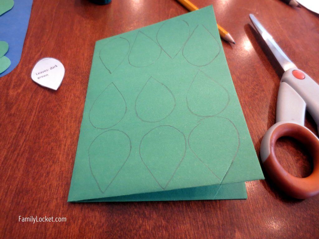 Cutting out leaves for family tree craft